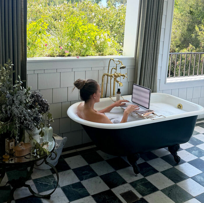 Jennifer Lopez, one of the celebrities, in a bathtub using a laptop, a scene from a top producer's revelations. Jennifer Lopez, one of the celebrities, in a bathtub using a laptop, a scene from a top producer's revelations.