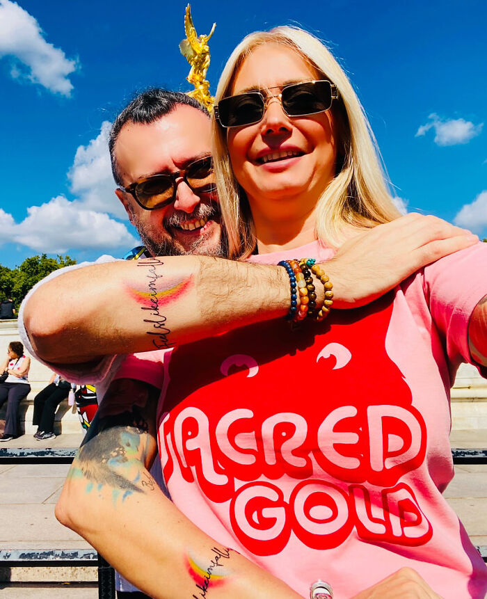 Matching ink ideas: a couple showing off their matching ink on their forearms, featuring colorful phrases.