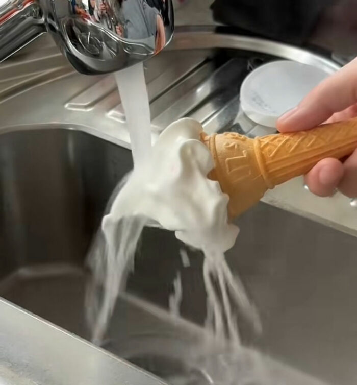 An ice cream cone under running water, showing the ice cream melting away, exposing fake foods Americans eat everyday. An ice cream cone under running water, showing the ice cream melting away, exposing fake foods Americans eat everyday.