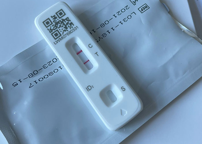 A COVID-19 rapid antigen test with a positive result, perhaps signaling a bad turn for first dates with women.