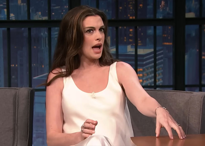 Anne Hathaway in an interview, discussing the harsh speculation surrounding her pregnancy after viral baby bump photos. Anne Hathaway in an interview, discussing the harsh speculation surrounding her pregnancy after viral baby bump photos.