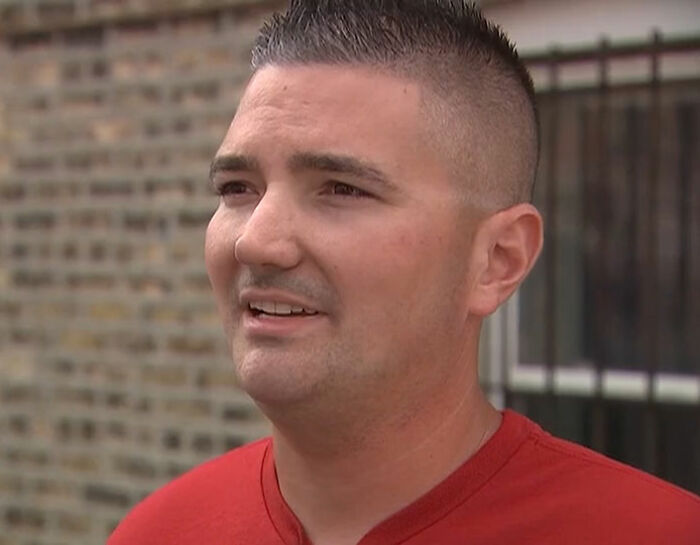 Portrait of the electrician who was stuck inside the 130ft high sign, looking relieved.