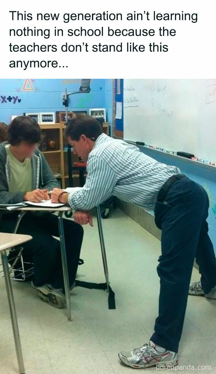 Teacher leaning over a student's desk in a classroom, a hilarious '90s meme about old teaching styles.