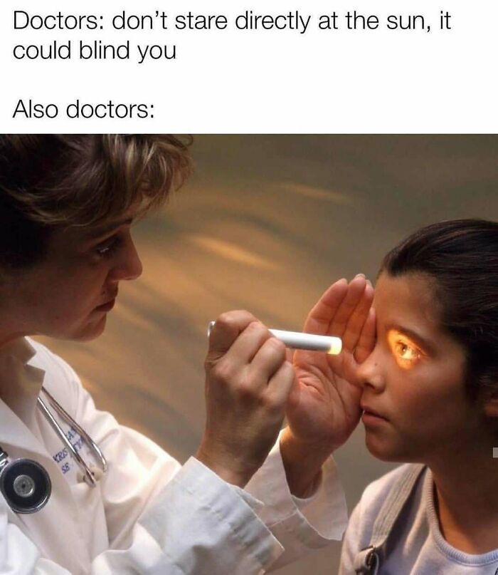 A doctor examines a child's eye with a bright light, a humorous medical book meme about doctors.