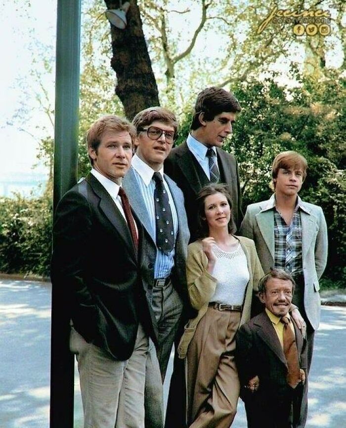 Cast of Star Wars posing in vintage attire, a classic moment nearly lost to history with Harrison Ford and Mark Hamill.