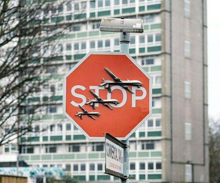 A stop sign with airplane silhouettes, a brilliant and beautiful design that is a highlight.