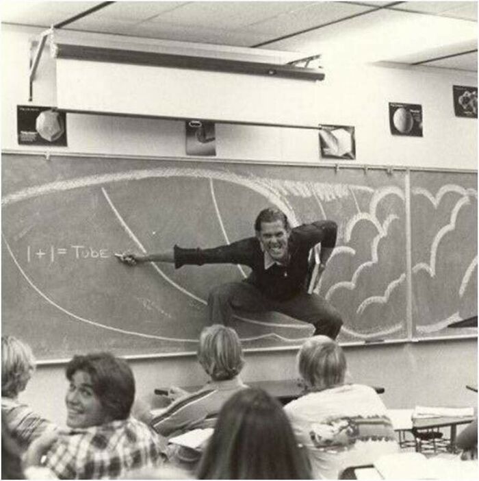 A teacher drawing a wave on a chalkboard, striking a surfing pose, a moment nearly lost to history.