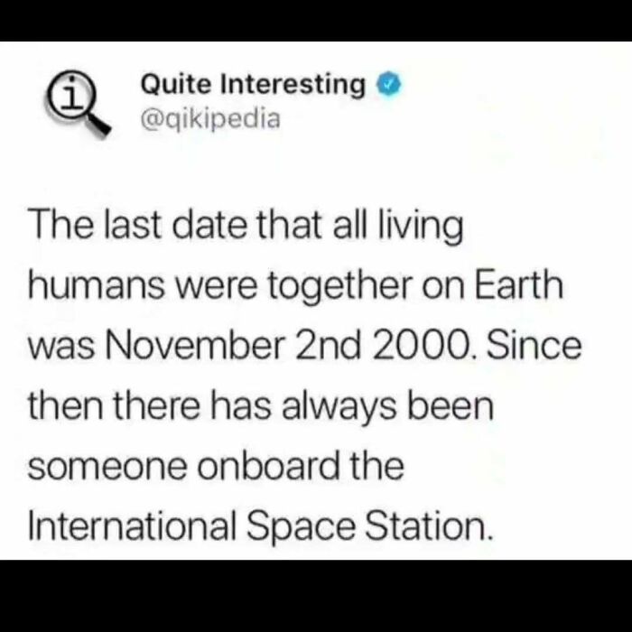 A tweet about living humans on Earth and the International Space Station, a funny science fact meme.