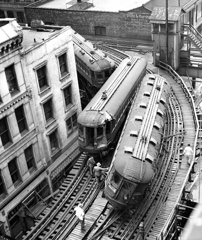 An aerial view of a dramatic train derailment in a city, a pivotal historical moment nearly lost to history.