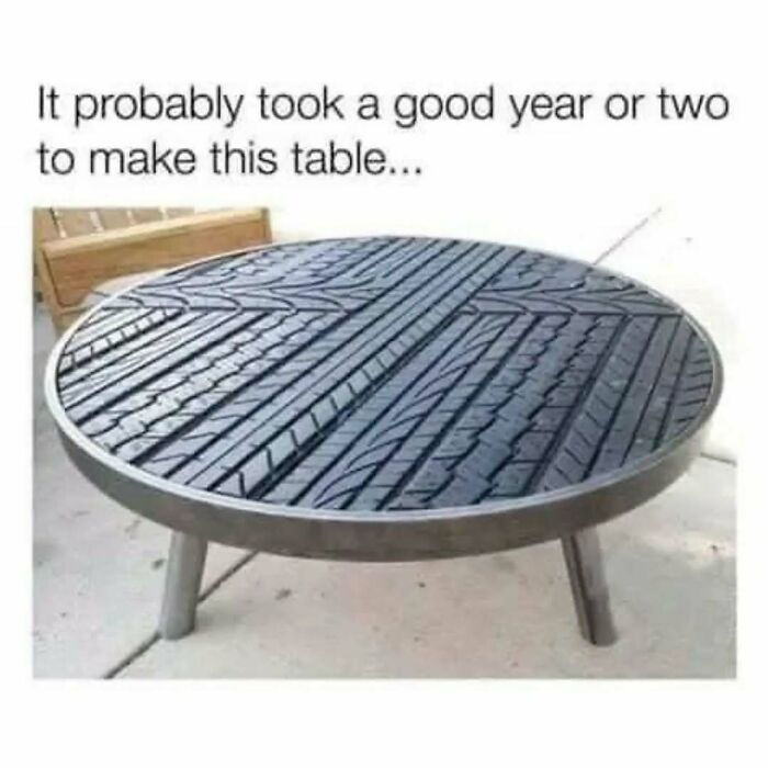 A funny meme with a unique table made from car tires, showcasing creative improvisation by car fans.