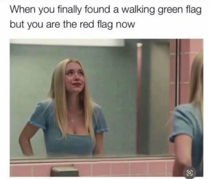 A meme queen looking in the mirror, crying about being the red flag in a relationship.