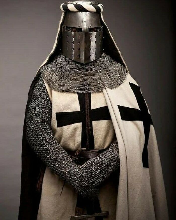 A knight in full armor, a lost moment in history, representing medieval warfare and heritage.
