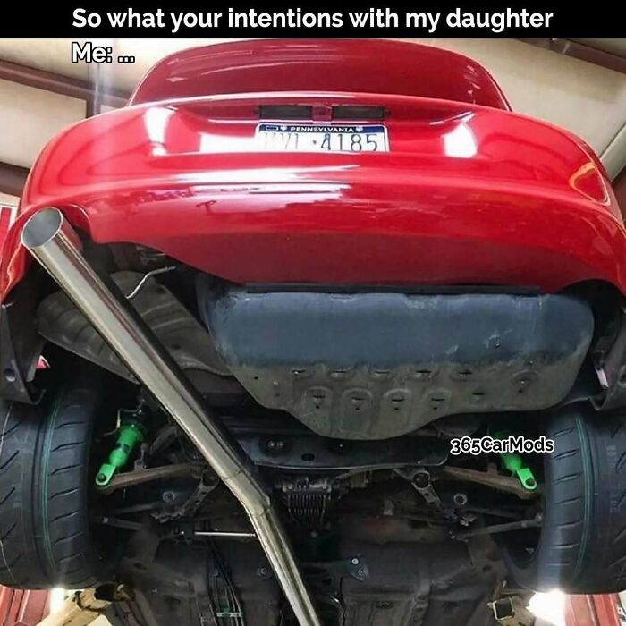 Funny meme of the underside of a red car showing a large exhaust pipe, humorously representing someone discussing cars.