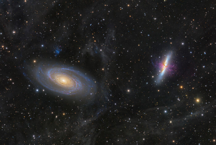 Captivating astronomy photo of two galaxies against a dark starry background, a beautiful universe view.