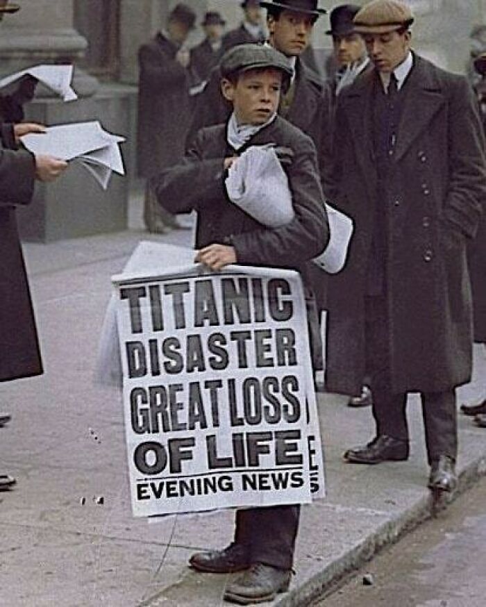 Young boy selling newspapers with the headline Titanic Disaster Great Loss of Life, capturing a tragic moment lost to history.