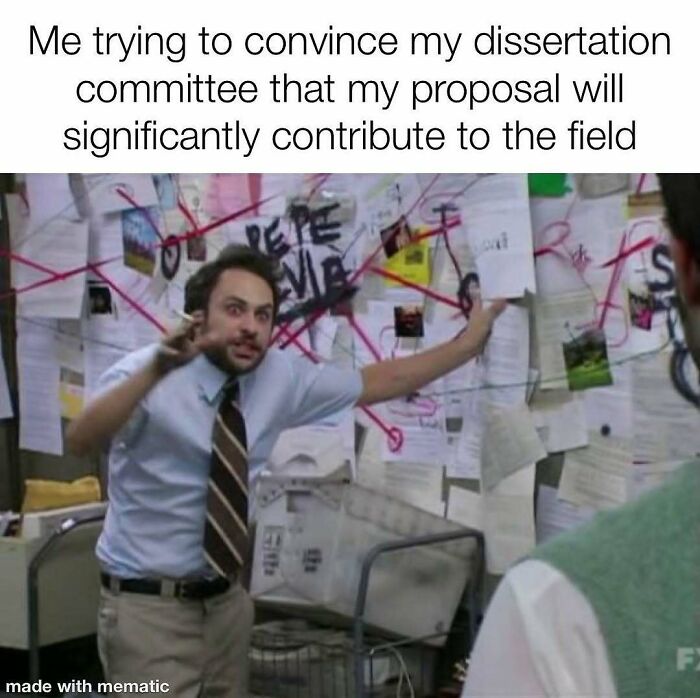 A PhD meme showing a man wildly gesturing in front of a wall covered in papers and strings, depicting a dissertation proposal.