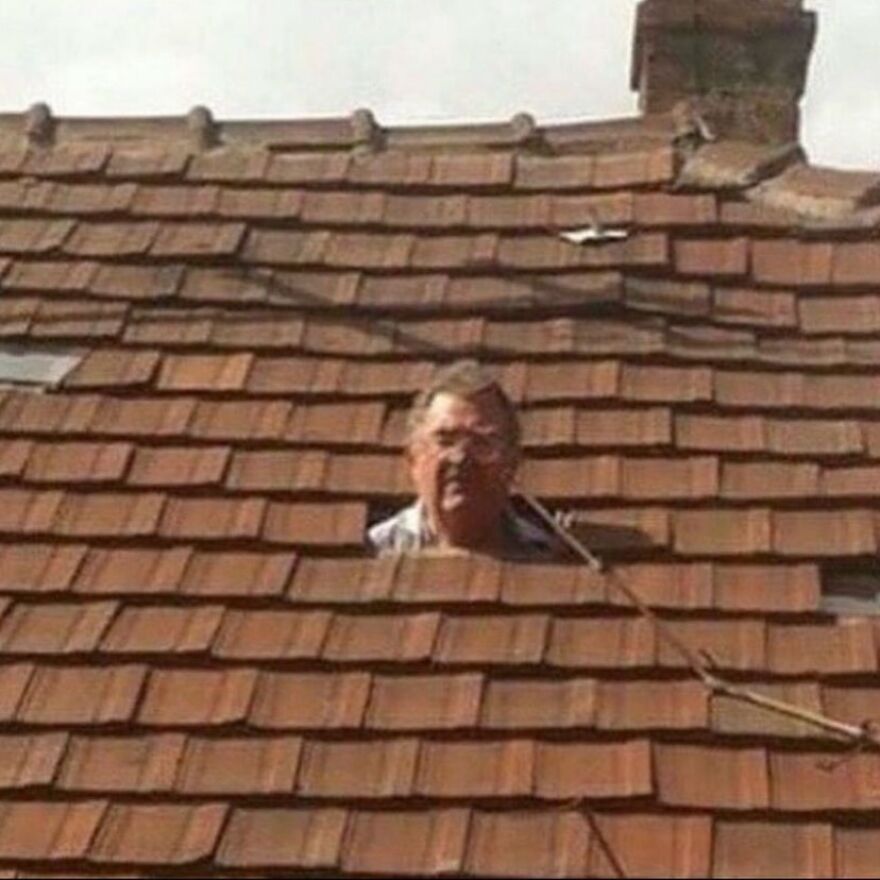 A man's head peering through a hole in a tiled roof, one of many unhinged images.