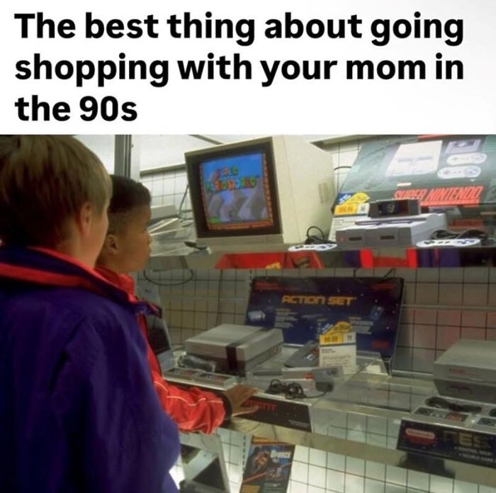 Two boys gazing at a Nintendo display in a 90s electronics store, a pure nostalgia gem.