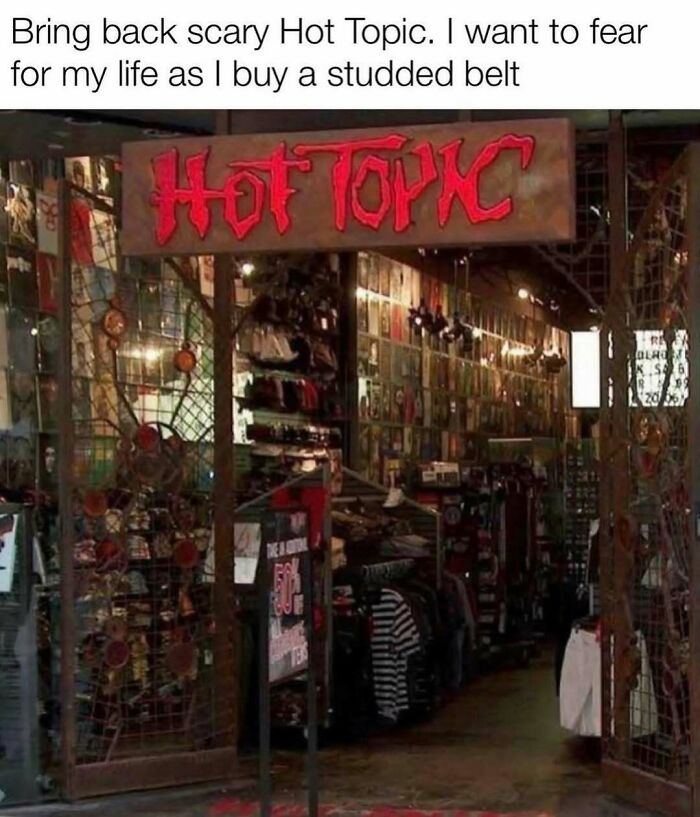 The dark, metal-barred entrance of an old Hot Topic store, a pure nostalgia gem for many.