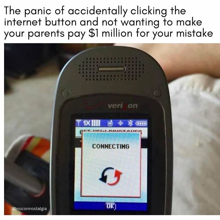 A close-up of an old Verizon flip phone showing 'connecting' on screen, a '90s and '00s internet panic.