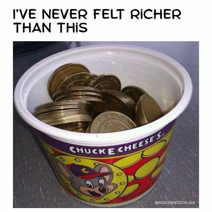 A cup of Chuck E. Cheese tokens, a nostalgic sight for people who experienced the magic of the 90s and 00s.