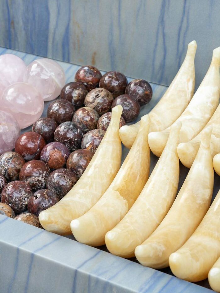 Brilliant and beautiful designs featuring polished rose quartz spheres and banana-shaped onyx objects.