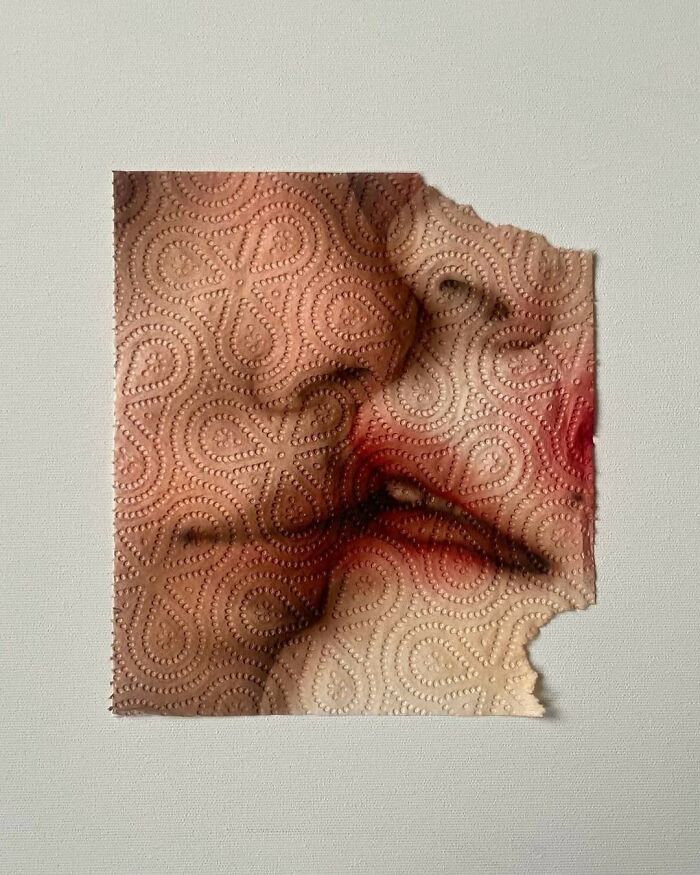 Brilliant and beautiful paper towel design with a face imprinted, displaying red lipstick and a bite mark.