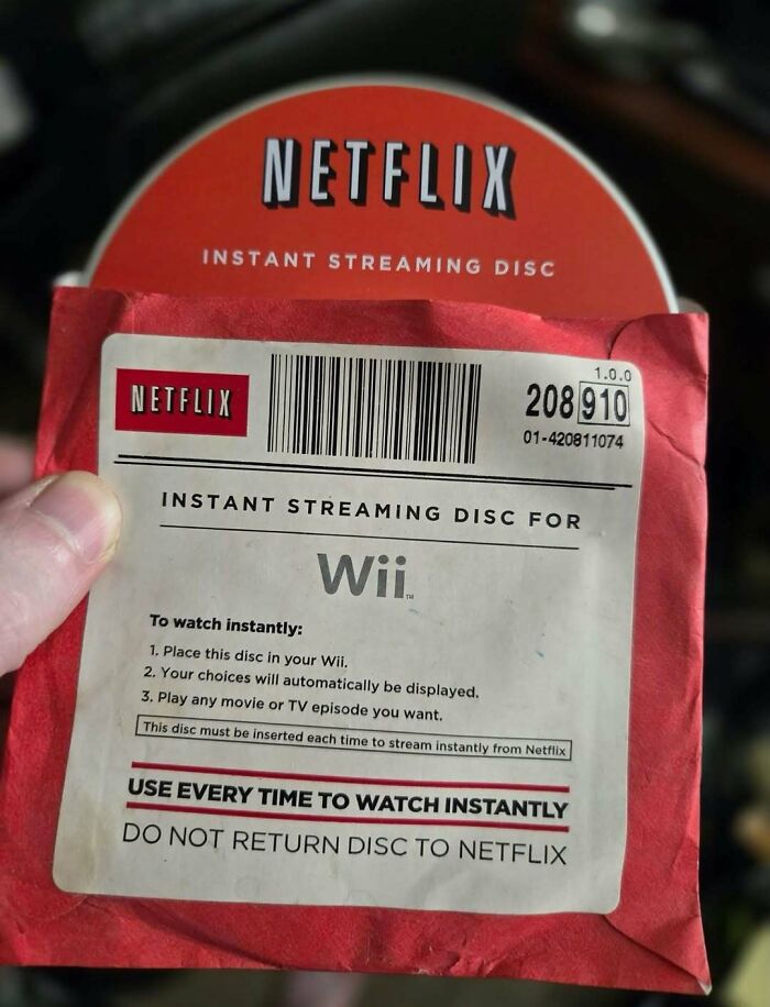A close-up of a Netflix Instant Streaming Disc for Wii, a nostalgic item from the 00s.