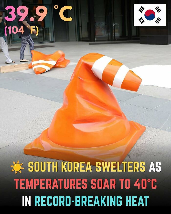 A large orange traffic cone melted and bent on a pavement in South Korea, demonstrating summer ruining everything.