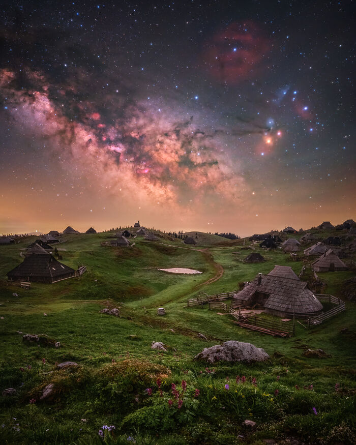 Vivid astronomy photo of the Milky Way over a village, a stunning ZWO shortlist image from 2026.