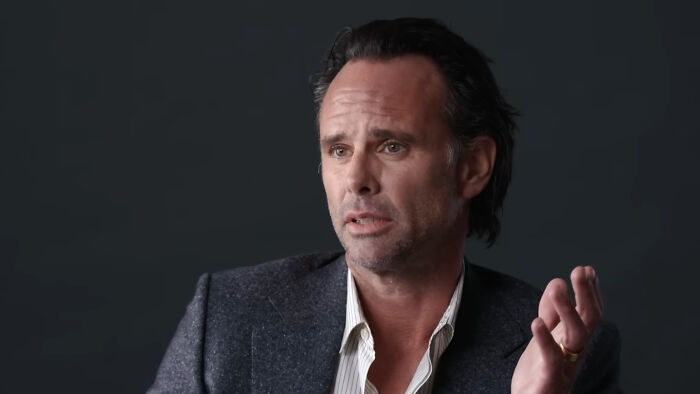 TV star faces backlash for his 84-episode flex, featuring a man with dark hair in a suit jacket, gesturing.
