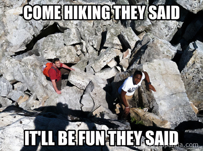 Two men struggling to hike up a rocky mountain, a travel meme about unexpected difficulties while traveling.