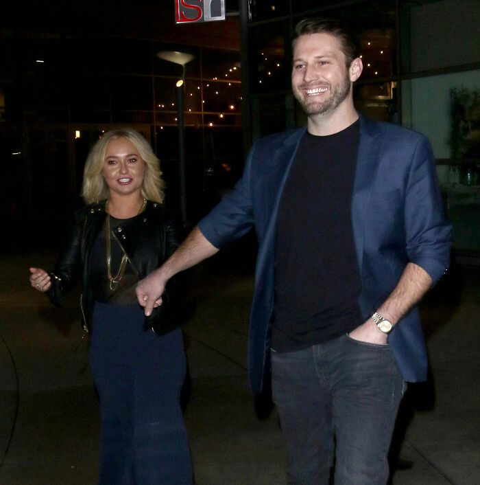 Hayden Panettiere walking with a man, amid fan fury triggered by her mom's statements and comparisons. Hayden Panettiere walking with a man, amid fan fury triggered by her mom's statements and comparisons.