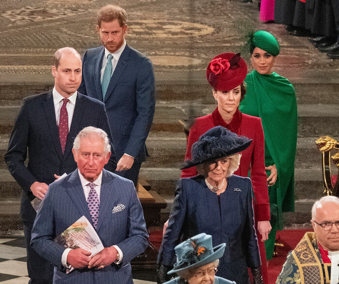 Prince Harry and Meghan Markle with other royals, hinting at potential scandalous theories surrounding their move back to UK. Prince Harry and Meghan Markle with other royals, hinting at potential scandalous theories surrounding their move back to UK.