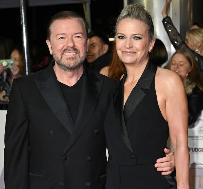 Ricky Gervais, 65, and his partner of 44 years, Jane Fallon, on a red carpet. Gervais plans to marry her. Ricky Gervais, 65, and his partner of 44 years, Jane Fallon, on a red carpet. Gervais plans to marry her.