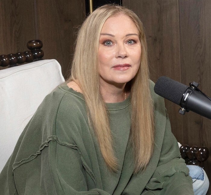 Christina Applegate's health battle update, showing her looking pensive during an interview. Christina Applegate's health battle update, showing her looking pensive during an interview.