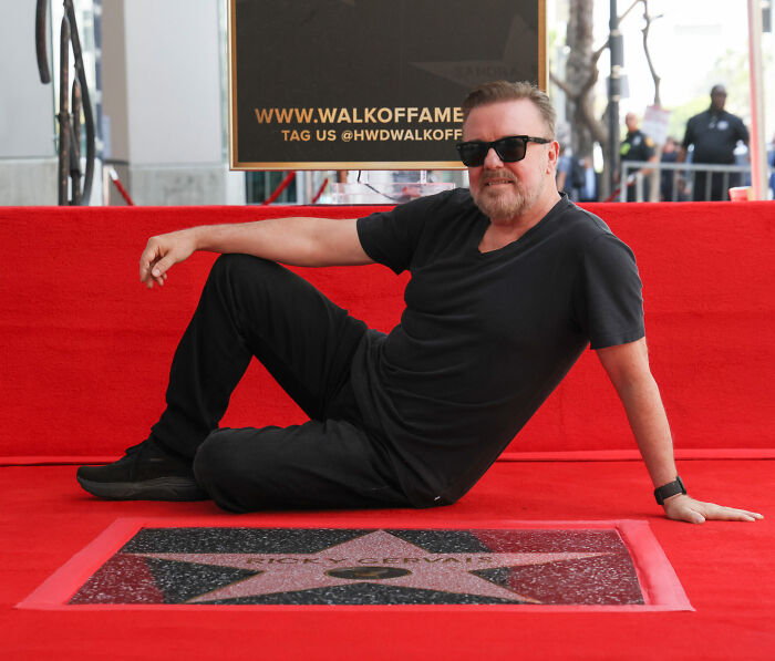 Ricky Gervais poses on the Walk of Fame, reflecting on why he plans to marry partner. Ricky Gervais poses on the Walk of Fame, reflecting on why he plans to marry partner.