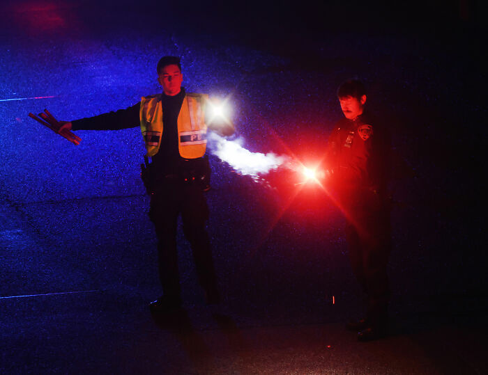 Air traffic controllers with flashing lights, possibly at the scene of the AirCanada crash. Air traffic controllers with flashing lights, possibly at the scene of the AirCanada crash.