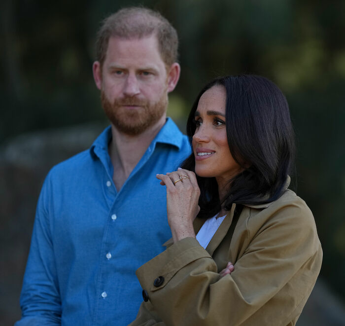 Meghan Markle and Harry, Duke of Sussex, looking concerned. Meghan Markle and Harry, Duke of Sussex, looking concerned.