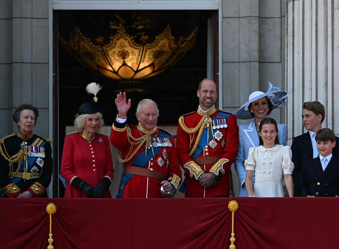 The Royal Family, including King Charles and Prince William, on a balcony, not including Meghan Markle. The Royal Family, including King Charles and Prince William, on a balcony, not including Meghan Markle.
