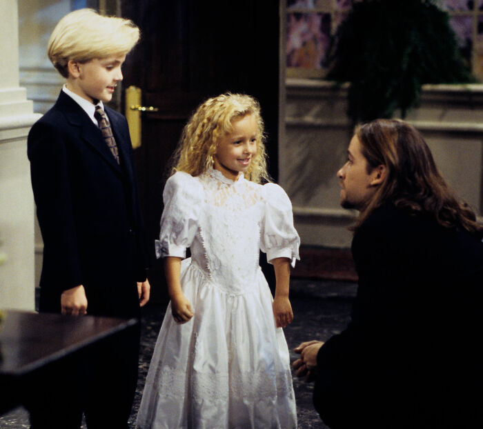 Hayden Panettiere as a child actor in a white dress, with two other actors. Hayden Panettiere as a child actor in a white dress, with two other actors.
