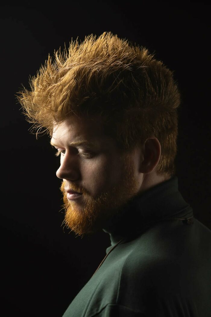 A profile of a natural redhead man with a beard and spiky hair, celebrating natural redheads.