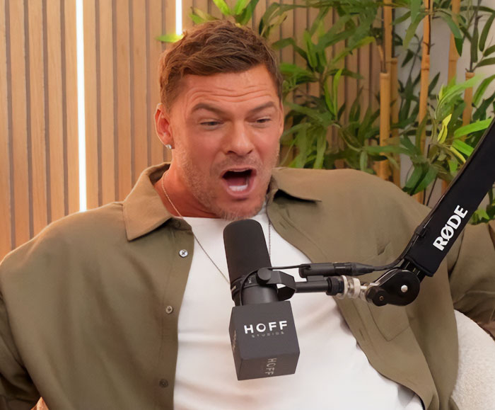 Alan Ritchson's shirtless moment, capturing him surprised while on a podcast. Alan Ritchson's shirtless moment, capturing him surprised while on a podcast.