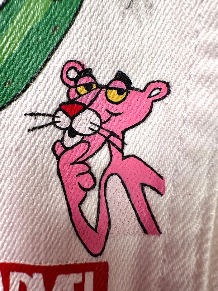 Artist created a custom jacket filled with pop culture characters like The Pink Panther that shaped Gen-Z childhood.