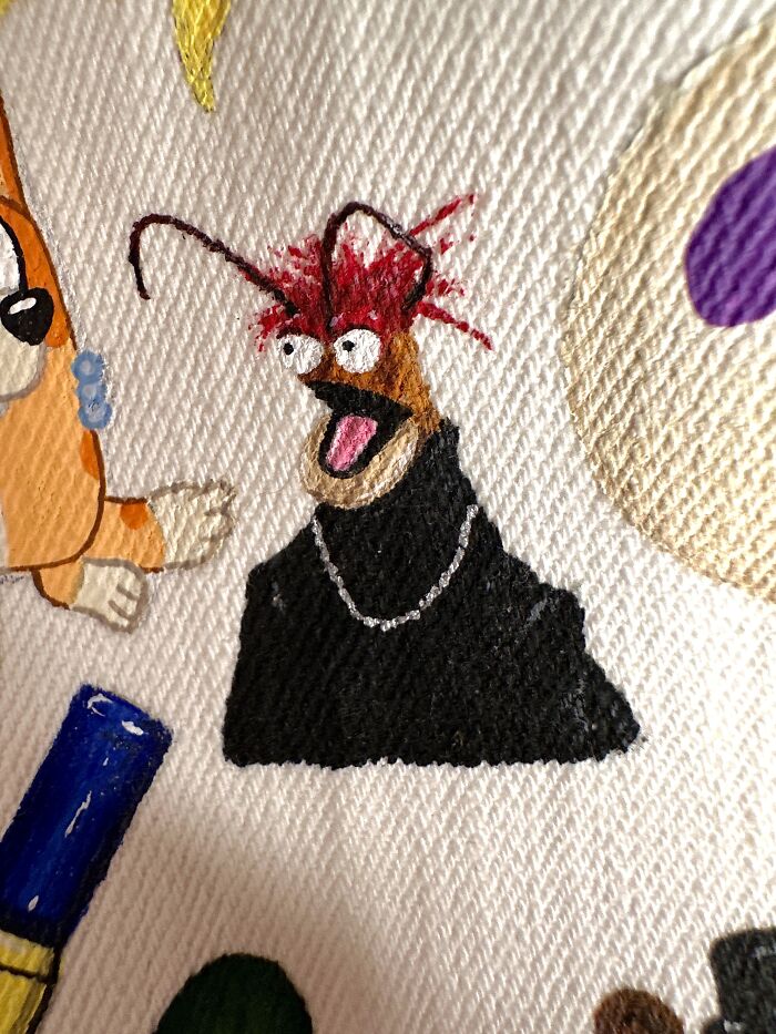 Detailed embroidery on a pop culture jacket with a character resembling Animal from The Muppets, for Gen-Z childhood.