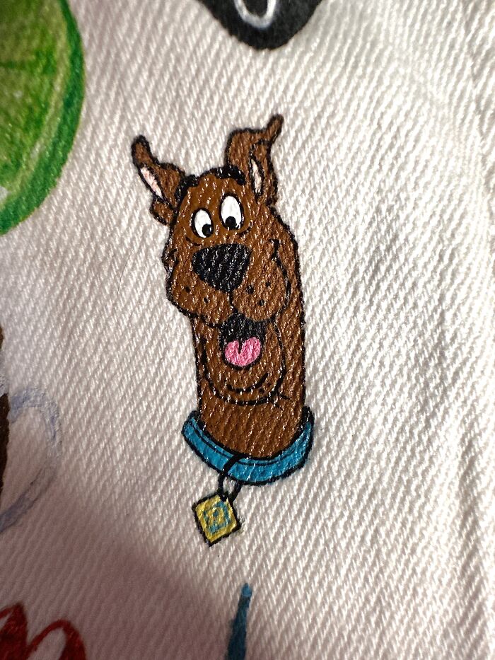 Detailed embroidery of Scooby-Doo's head, an element on a jacket filled with pop culture references from Gen-Z's childhood.