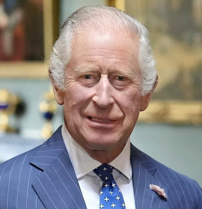 King Charles III smiling, possibly related to Meghan Markle and Prince Harry move back to UK. King Charles III smiling, possibly related to Meghan Markle and Prince Harry move back to UK.