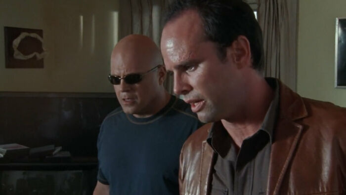 Walton Goggins with a fellow actor in a scene, as the TV star faces fan backlash for his 84-episode flex.