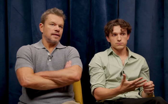 Matt Damon and Tom Holland in a close-up, focusing on their expressions as great actors. Matt Damon and Tom Holland in a close-up, focusing on their expressions as great actors.