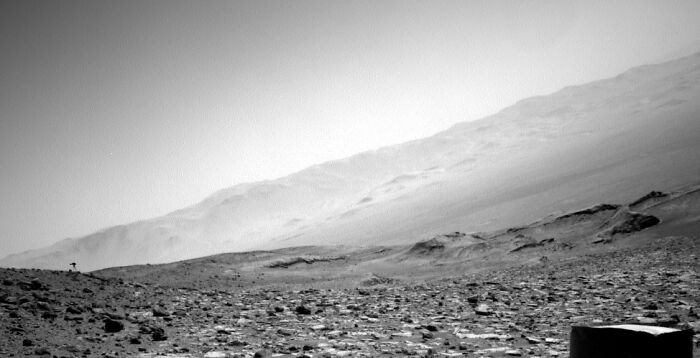 Black and white landscape of Mars with a rocky foreground and hazy mountains in the distance. No jellyfish. Black and white landscape of Mars with a rocky foreground and hazy mountains in the distance. No jellyfish.